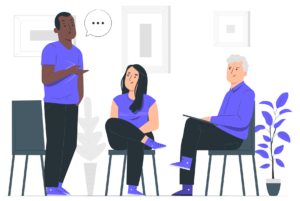 Illustration d’un atelier collaboratif où trois personnes discutent autour d’un chevalet. Un homme debout, vêtu d’un t-shirt bleu, semble expliquer un concept en gesticulant, tandis qu’une femme assise, également en bleu, écoute attentivement. Un autre homme, assis à droite, prend des notes sur une tablette. Des bulles de dialogue au-dessus de leurs têtes symbolisent l’échange d’idées. En arrière-plan, des cadres vides et une plante stylisée ajoutent une touche minimaliste et moderne à la scène. Cette illustration représente la dynamique de co-construction et de partage d’expertises au cœur du projet Inclusiversel tourism.